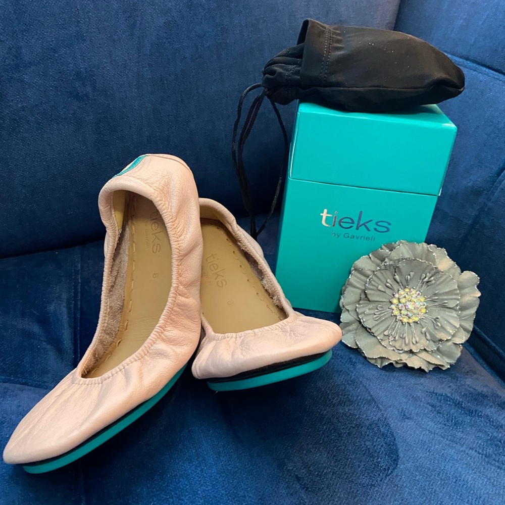 Brand new. Never worn. Ballerina pink Tieks. Not my type of color.